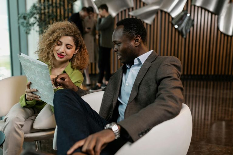 A diverse team of colleagues engaged in a productive meeting in a stylish office setting.